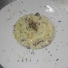 Risotto agli agrumi di Sicilia mantecato con tartufo nero del Feudo Bauli, olio d'oliva DOP, fonduta di parmigiano reggiano e scalogno stufato - -