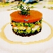- Torre del Mare - - Torre multistrato di pat� di olive nere di Gaeta, broccoletti baresi, astice al vapore di Brandy e gelatina di pomodoro San Marzano. 