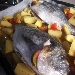 -Orata macchiata al forno con spicchi di patate in camicia - -