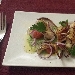 -Tagliata di Calamaro - -Tagliata di Calamaro con Cipolla rossa, pomodorino Confit su crema di piselli