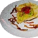 Capelli d'angelo con baccal�, zucchine verdi e crema di porro, su cialda di caciocavallo stagionato - -