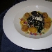 Pesce spada in farina di olive, o granella, adagiato su passatina di ceci, prezzemolo croccante, con polpettine di verdurine e gocce di zucca con fiori di campo essiccati - -