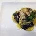 Ravioli di pasta fresca con striature al nero con ripieno di baccal�, carciofi, uvetta, pinoli e pecorino, conditi con fondo di baccal� e carciofi. 
Questo � uno dei piatti che ti propone oggi lo chef. 
Vienici a trovare per provare questa e tante altre prelibatezze. - -