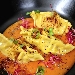 Ravioli ripieni di baccal� e patate con riduzione di pomodoro fresco, polvere di gambero rosso, semi di papavero e germogli di barbabietola rossa - -