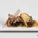 Lombetto di Agnello delle Dolomiti Lucane con cuore di Uva Rosa di Pisticci Caramellata su Schiacciatina di Patate,  Concass�e di Fico Rosa di Pisticci Caramellato, Dripping al Ficotto, Erbette Campestri al Salto, Funghi Cardoncelli, Vela di Pane e Croccante di Matera IGP- - -