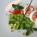 Gamberi e calamari in olio cottura, carpaccio di zucchine alle erbe, pomodorini e nocciole - -