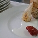 
Tortino con cardoncelli, burrata, su fonduta di caciocavallo e pera disidratata.  - -