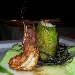 Roll� di branzino con gamberi rossi e pistacchi in foglia di lattughina su vellutata di patate al limone e capperetti di Pantelleria con bavarese di melanzane - -