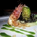 Roll� di branzino con gamberi rossi e pistacchi in foglia di lattughina su vellutata di patate al limone e capperetti di Pantelleria con bavarese di melanzane - -
