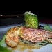 Roll� di branzino con gamberi rossi e pistacchi in foglia di lattughina su vellutata di patate al limone e capperetti di Pantelleria con bavarese di melanzane - -