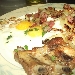 -costolette al forno con patate saltate cipolla ,speck e uova - -