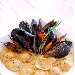 Agnolotti ripieni con cernia e noci con sout� di cozze tarantine - -