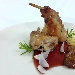 Coscette di coniglio con il suo fegatino su riduzione di vino rosso secco siciliano aromatizzato all'arancia e cannella - -