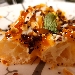 la Crisommola - Trancio di pizza fritta con ricotta di bufala campano DOP aggiustata con buccia di limone, confettura di albicocche del Vesuvio, nocciole tostate, olive disidratate, menta fresca
 - -