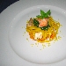 Pappardelle di grano duro allo zafferano con polpa di scampi, dadolata di pescatrice e vongole saltate con julienne di zucchine - -