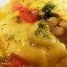Raviolo di pasta fresca farcito con tenerumi, ricotta alla cannella e femminello con gambero bianco marinato su guazzetto di scorfano - -