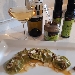 medaglioni di spinaci ripieni di ricotta e spinaci lessi casarecci  su salsa di cereali, pat� di olive e mandorle - -