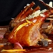 Costolette di capretto arrosto con mandorle e miele amaro di corbezzolo - -
