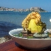 Friarielli in gabbia di polenta e polpo croccante con fonduta di caprino. Fotografia di Domenico Lepore - -