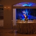 Resort Oleandri (Paestum - SA) - La luce argentea degli ulivi al di l� delle vetrate contrasta con quella nei caldi toni dell'ambra che all'interno della sala crea un'atmosfera intima e ovattata, una dimensione quasi sospesa