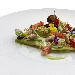 Raviolo di pasta cotta ripieno di ricotta e limone, salsa di zucchine, vongole, gambero rosso e briciole di pane - -