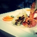 -Secondi di Mare. - Baccal� grigliato con Gamberone lardellato in doppia cottura con riduzione di anatra e agrumi, con note di balsamico invecchiato in botti di ciliegio.-