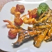 Ravioli di branzino mantecato con pomodorini, ripieno di gamberi - -