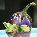 Raviolini farciti con ricotta di bufala e pesto al basilico, con vellutata fredda di melanzana fior di viola - -